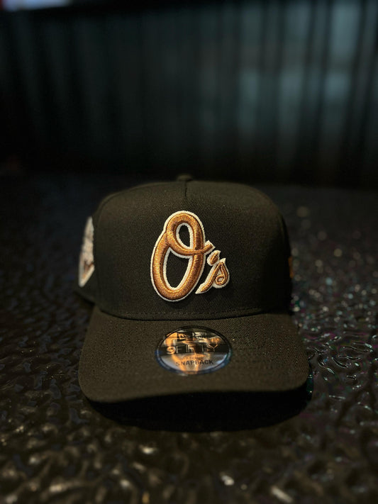 GORRA NEW ERA ORIOLES BRONZE BLACK GOLD SNAPBACK