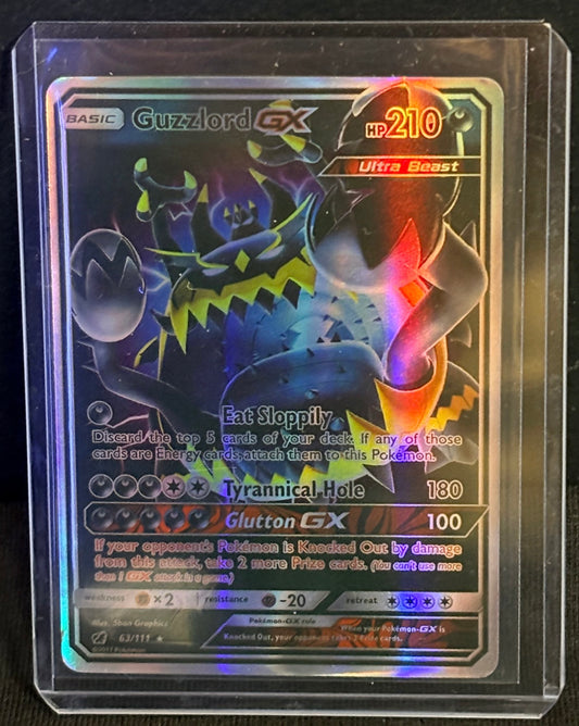 CARTA POKEMON Guzzlord GX 63a/111 – Alternate Art